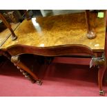 An early Georgian style figured walnut serpentine front fold-over baize-lined card table, having a