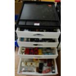 A five-tier plastic storage tray, containing a quantity of mixed scale diecast, to include Oxford