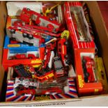 A box containing a quantity of fire engine and emergency service boxed and loose diecast figures, to