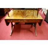 A 19th century flame mahogany and rosewood crossbanded dropflap sofa table, having twin frieze