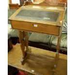 An Edwardian oak and chequer inlaid three-quarter gallery back slopefront school desk, having hinged