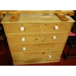 A Victorian pine round cornered chest of two short over three long drawers, having white ceramic