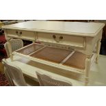 A contemporary cream painted round cornered two drawer coffee table, having cane inset undertier,