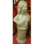 A classical style green and gilt patinated stoneware pedestal bust of a woman on matching circular