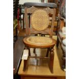 A cooper inset circular bird-bath, of dished form; together with a relief carved walnut and wicker