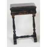A 19th century chinoiserie black lacquered needlework table, having fitted interior (with age wear),