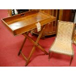 A 19th century mahogany butlers tray, on folding stand; together with a 19th century oak and cane