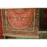 A contemporary Kashan red ground rug, 190 x 140cm