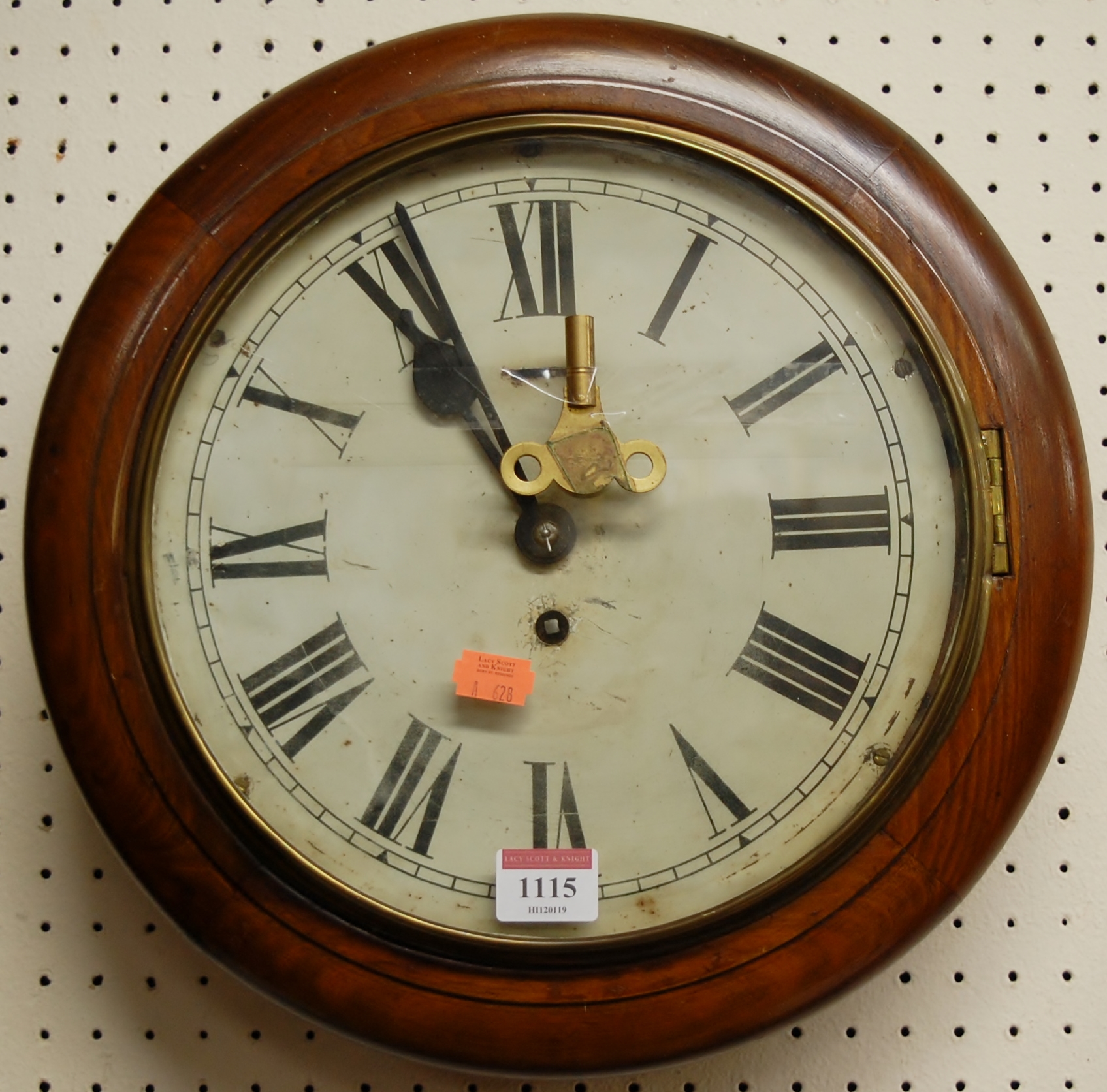 A Victorian mahogany circular school clock, having white painted 10" dial and winding key