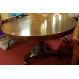 A 19th century plum-pudding mahogany circular fixed top pedestal breakfast table, raised on