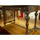 A Continental late 19th century carved walnut single drawer side table, raised on acanthus leaf