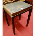 An early 20th century butchers block, raised on integral black painted iron mounted stand, w.62.5cm