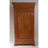 A 19th century French provincial joined cherry-wood armoire, having a moulded cornice over single