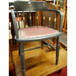 An early 20th century painted oak and rexine padseat stickback tub desk chair