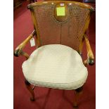 A walnut, figured walnut and cane inset tub elbow chair