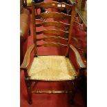 A contemporary Lancashire oak ladderback rush seat single elbow chair, together with a 19th