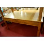 An early 20th century light oak two drawer writing table, w.152cm
