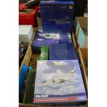 A box containing a quantity of boxed and loose diecast aircraft models and Authentic Rail Legends