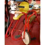 A vintage 1960s childs scooter, together with a pressed steel rocking horse (2)