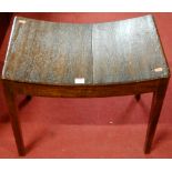 An early 19th century mahogany stool having a dished seat, width 55cm