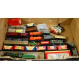 A box containing a quantity of 00 gauge loose and boxed rolling stock and locomotives, to include