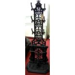 In the manner of Coalbrookdale - a black painted and cast iron hall stand, having twin lower