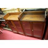 A pair of 1930s oak double door glazed low bookcases, w.60.5cm