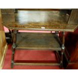 An early 20th century oak two-tier side table, raised on turned and square cut supports, w.84cm