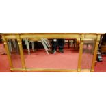 A Regency style reeded gilt framed triptych overmantel mirror having acanthus leaf detail, circa
