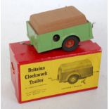A Britains No. 2041 Civilian clockwork trailer comprising green body with tan load and red hubs,