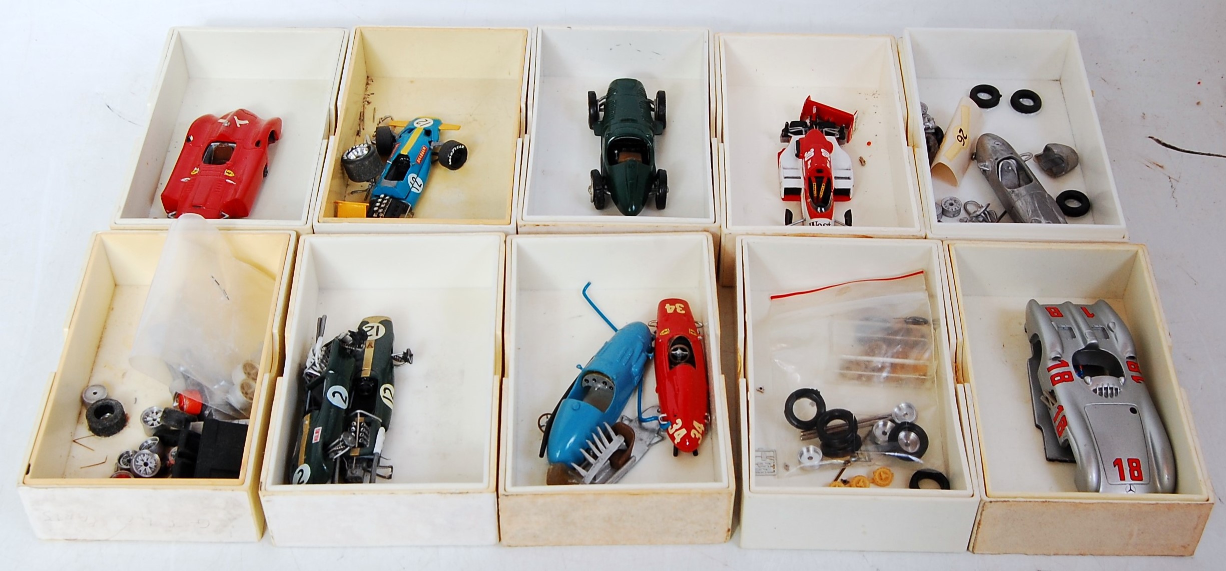 13 various plastic boxes containing a quantity of white metal and resin classic car kit spare