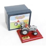 A Britains No. 8711 Ferguson TE20 tractor comprising grey body with driver figure raised on