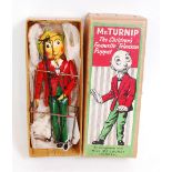 A Mr Turnip puppet taken from the BBC television series, finished in red, green and yellow, in