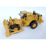 An OHS white metal and diecast model of a Caterpillar 854G wheeled bull dozer finished in yellow