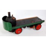 A live steam powered four wheel sentinel type steam wagon finished in green, black and red,