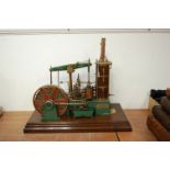 A finely built vintage beam engine titled WJS Beam Engine, on painted brass beam and WJS Norwich