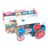 A Wilesco D40 Old Smoky traction engine, comprising blue, silver and grey body with red spoked