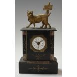 A late 19th century black slate mantel clock, having an enamelled dial with Roman numerals and