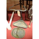 A Victorian cast iron black enamelled stickstand of triangular form, together with a Victorian