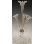 A Victorian clear glass table epergne having four trumpets to circular dish base, height 54cm