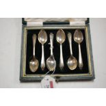 A set of six George V silver teaspoons in green leather fitted case