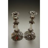 A pair of Victorian silver plated candlesticks, each having removable sconce cast with ivy leaves,