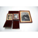 A large Victorian daguerreotype depicting a seated gentleman in robes, in fitted leather case (a/f);