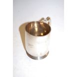 A George V silver tankard, of plain undecorated form with C-scroll handle, inscribed Peter, maker