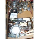 A box of miscellaneous silver plated wares, to include photograph frames, loose flatware, fish
