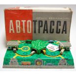 A circa 1950s Russian Abtotpacca tinplate clockwork train station and road toy, boxed