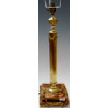 A brass pedestal oil lamp having urn shaped finial to fluted column on stepped onyx base, height