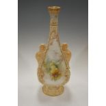 A large Doulton Burslem blush ivory vase of lyre shape decorated with flowers having griffin