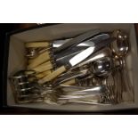 A box of miscellaneous silver plated wares, to include four division toast-rack, loose flatware etc