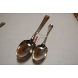 A George III silver stuffing spoon; together with a George III silver serving spoon (2)